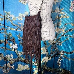 Brown leather, fringed, cross body purse.